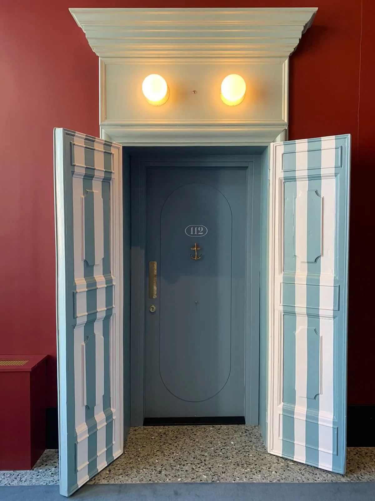 Hospitality interior with striped door panels – Paolo Rota Interiors