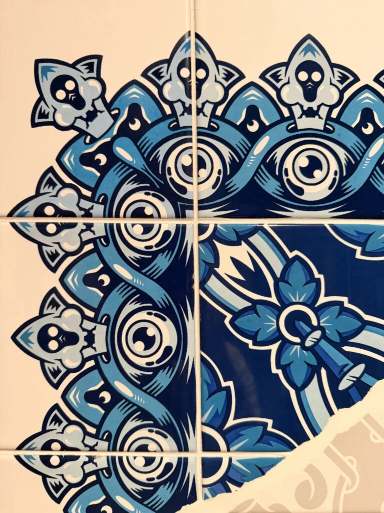 Close-up detail of Add Fuel street art ceramic tiles for luxury interior decoration