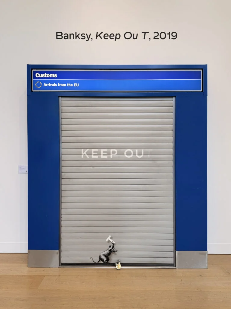 Banksy Keep Ou T 2019 installation featuring Heathrow customs shutter portal with stenciled rat unlocking padlock at Phillips Modern and Contemporary Art auction