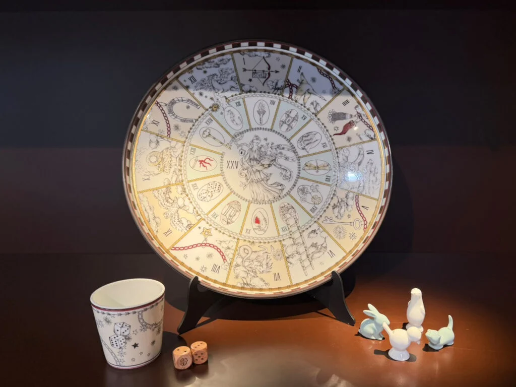 Ginori 1735 Fortunae Game of the Goose porcelain centerpiece platter with animal game pieces and dice cup at Design Miami Paris