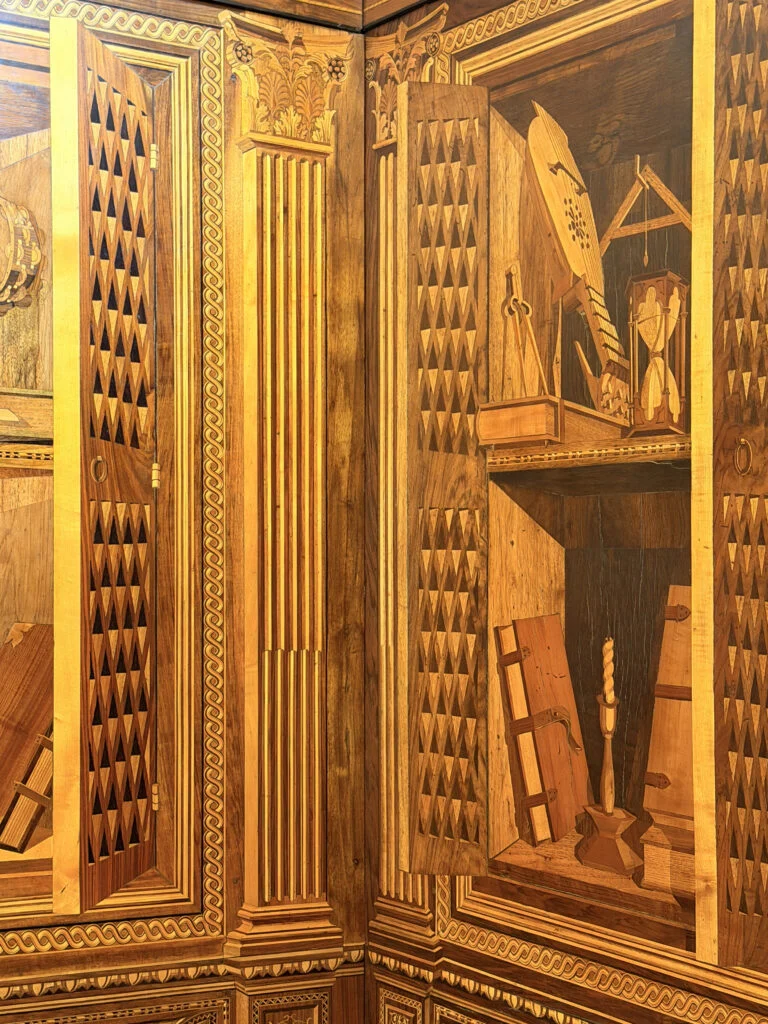 Trompe l'oeil intarsia cabinets inside the Palazzo Ducale Studiolo, inspiring Italian furniture and bespoke joinery