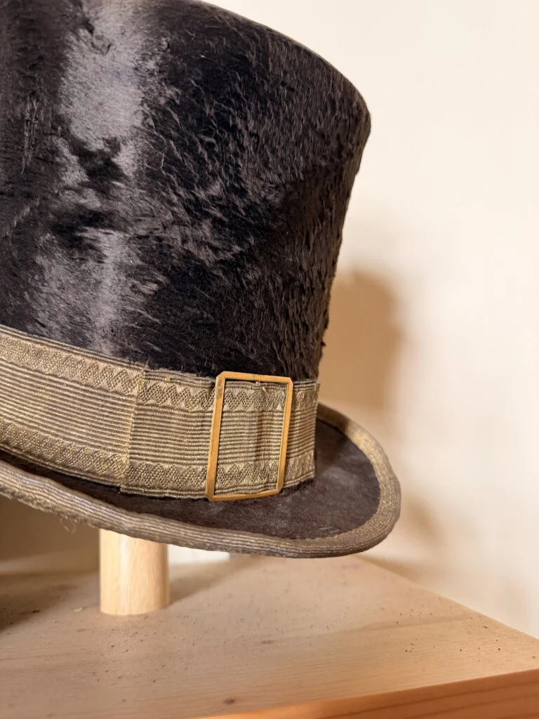 Close-up of vintage hat hardware and textile details in Gubbio, inspiring luxury furniture procurement and custom finishes