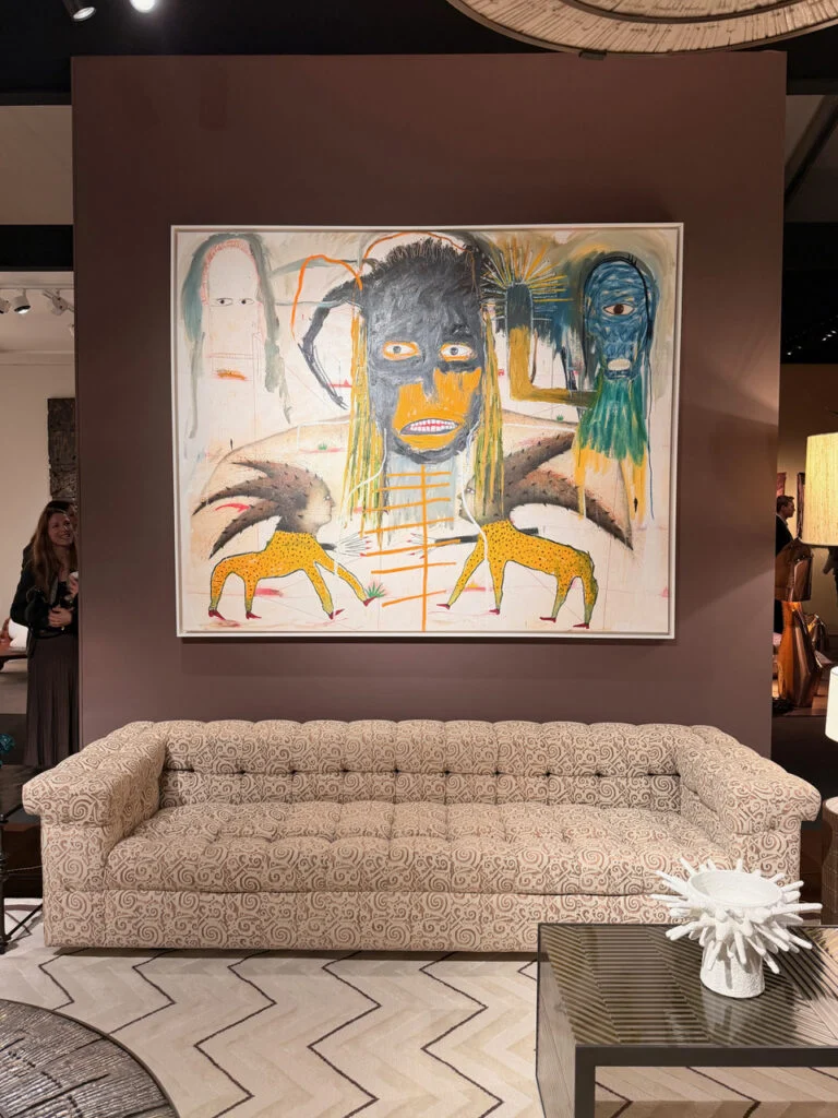 Chahan Gallery curated living setting with large figurative canvas, tufted sofa, and textured table at PAD London
