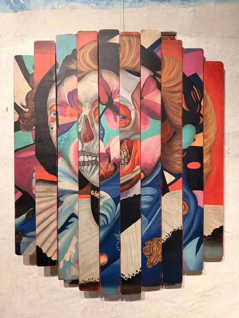 Multi-panel slatted wood artwork by Mr Brainwash for luxury residential interiors.