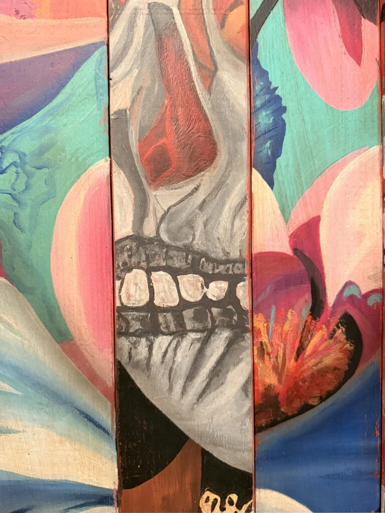 Close-up texture detail of Mr Brainwash artwork curated by a luxury interior designer