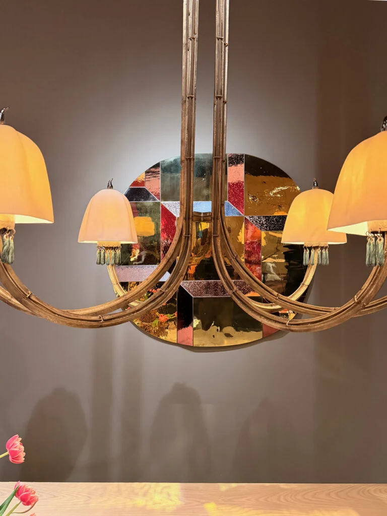 Sam Orlando Miller tinted faceted mirror installation behind sculptural chandelier at Gallery FUMI, PAD London